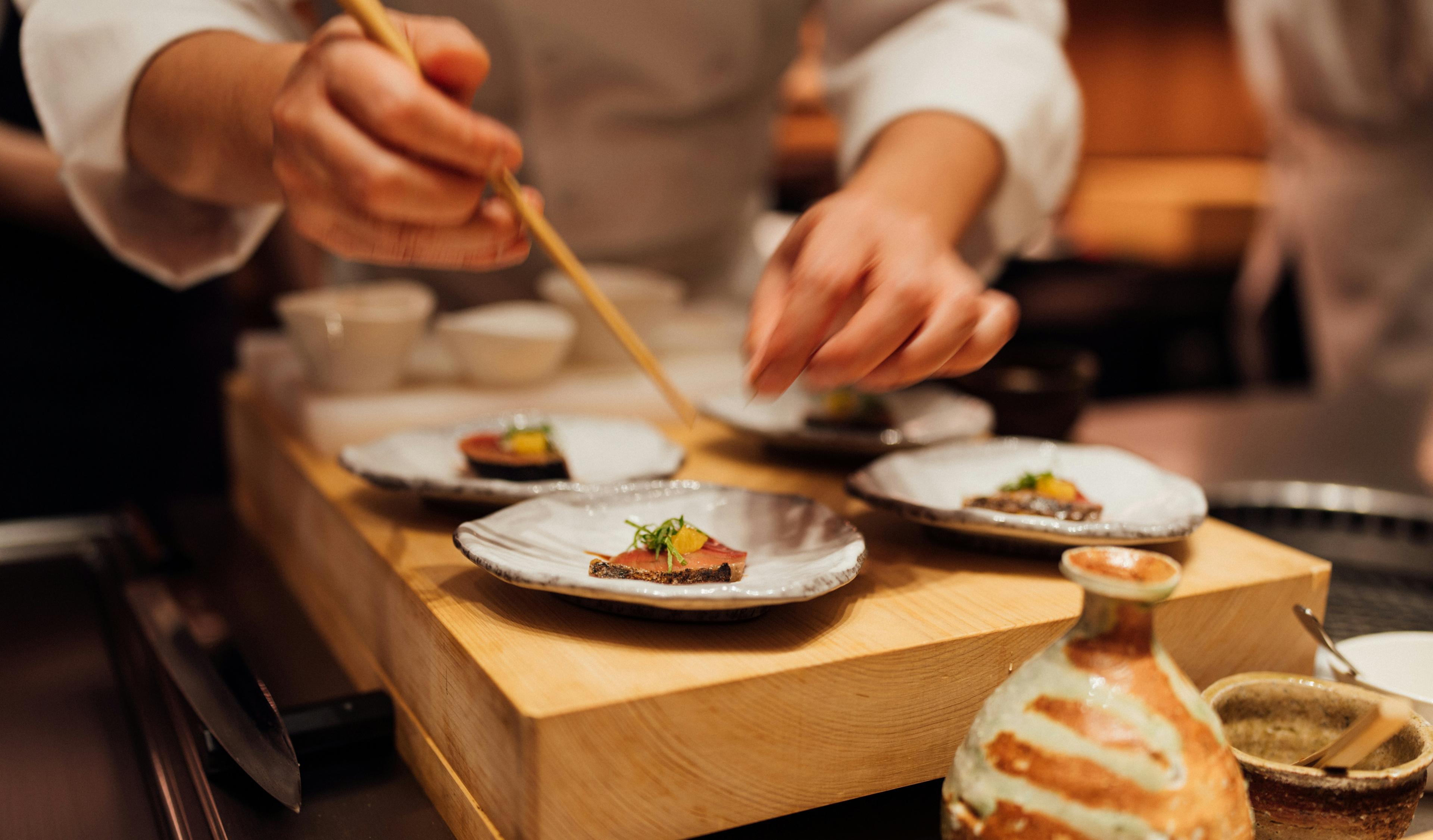 Chef preparing dishes in open kitchen